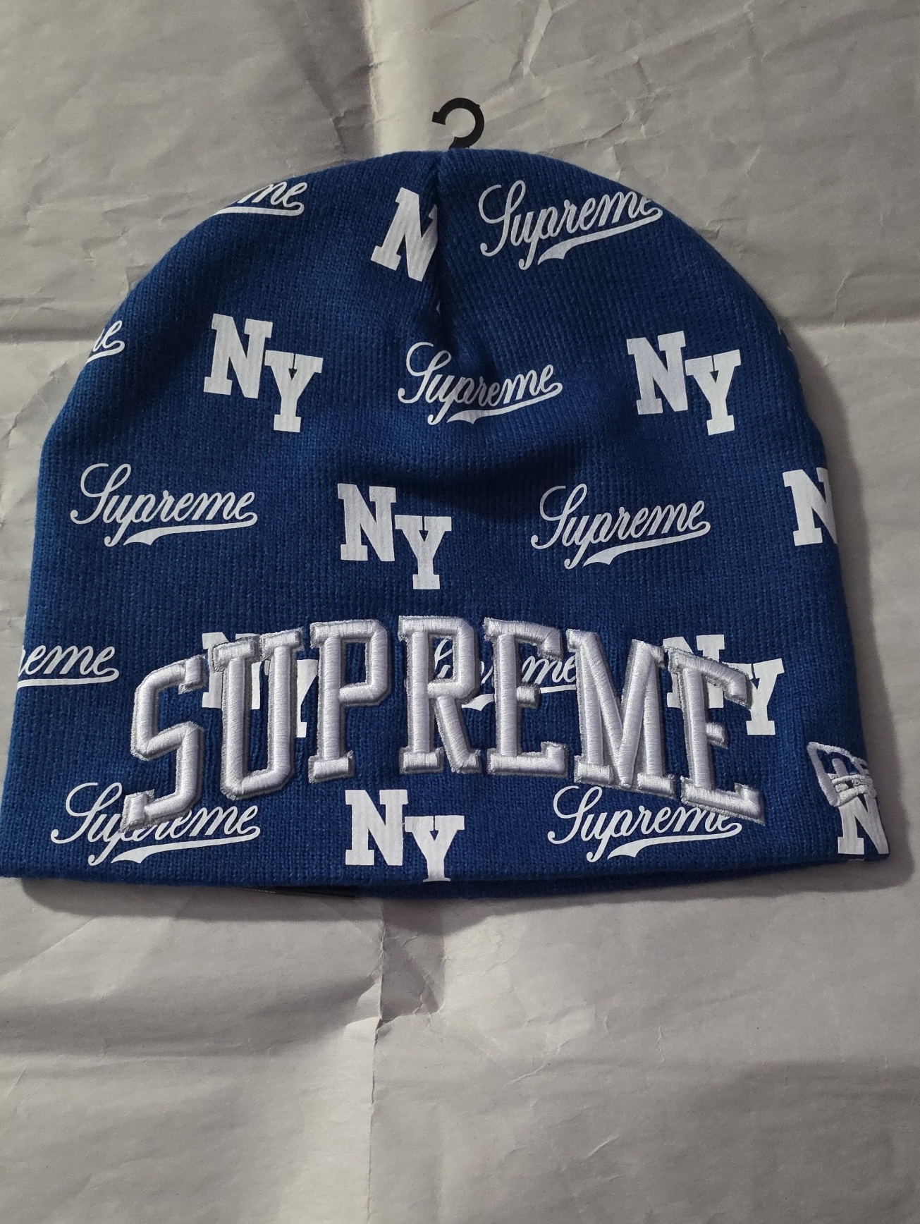Brand New Supreme And New Era Royal Blue Beanie With White Logos.